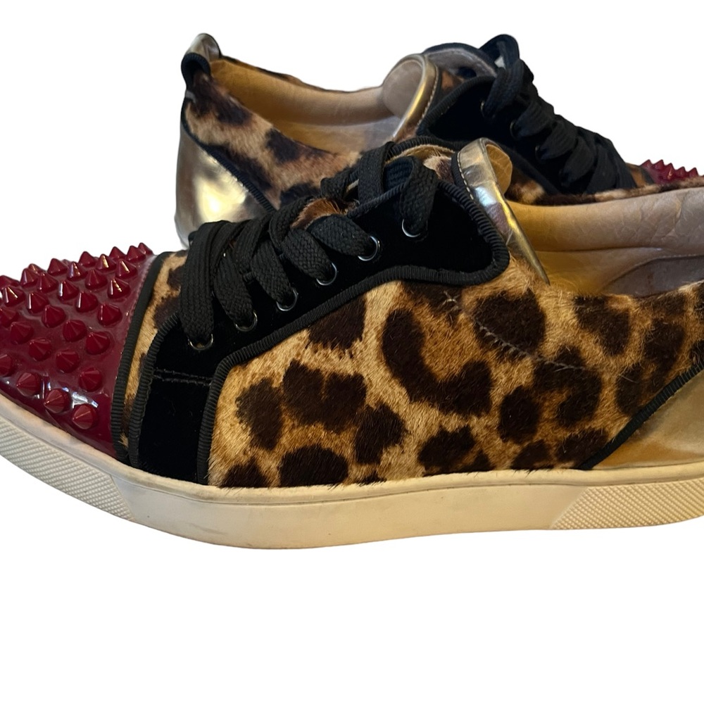 CHRISTIAN LOUBOUTIN Calf Hair Louis Junior Spikes Flat Sneaker in a sexy Leopard